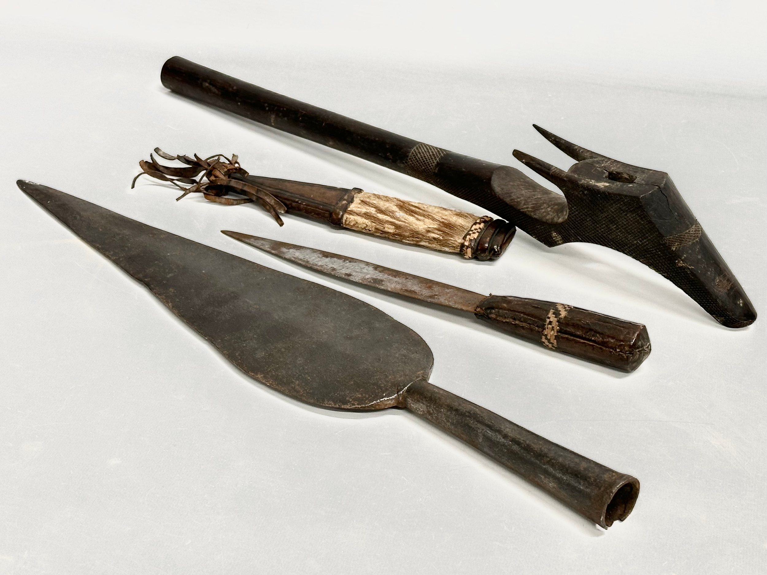 Late 19th/early 20th century African Tribal weapons. A spear head 47.5cm.