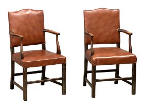 A pair of early 20th century, George III style oak armchairs.