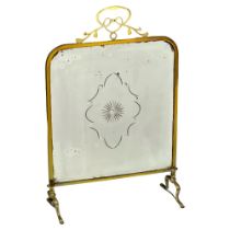 An Early 20th Century Art Nouveau brass mirror firescreen. Circa 1900-1910. 47x20x72cm