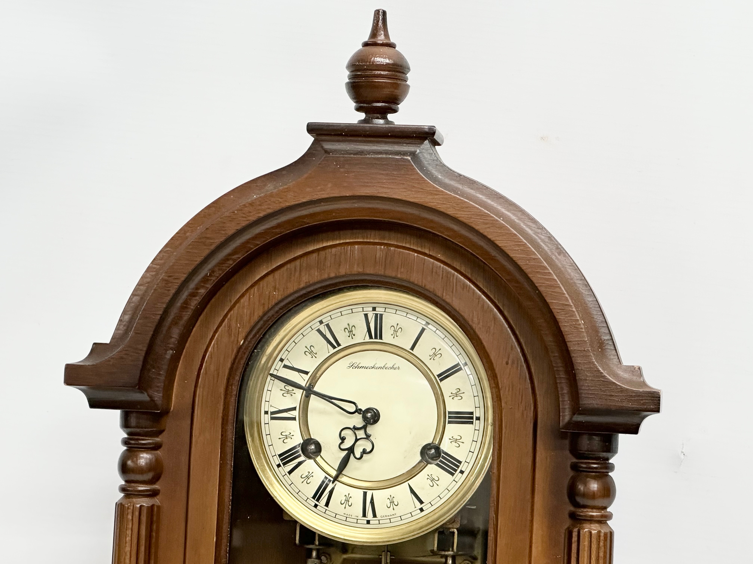 A 19th century style Schmeckenbecker wall clock. With key and pendulum. 63cm - Image 3 of 4