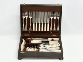 An Early 20th Century oak cased canteen on cutlery. 36x29x10cm