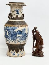 A large 19th Century Chinese baluster vase. Decorated with blue and white warriors between 2 bands