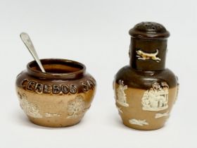 An early 20th century Royal Doulton Lambeth 2 piece condiment set. Salt and pepper shaker.