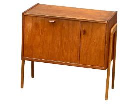 A Danish Mid Century teak side cabinet with maple interior. 1960’s. 72x40x64cm