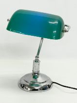 A desk lamp with plastic shade. 28x36cm