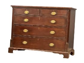 A George IV mahogany chest of drawers with Doric columns and brass drop handles. Raised on bracket