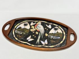 A Mid 20th Century Brazilian serving tray with Mother of Pearl parrot and butterfly design. 70x41cm