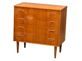 A Danish Mid Century teak chest of drawers. 77x41x79cm