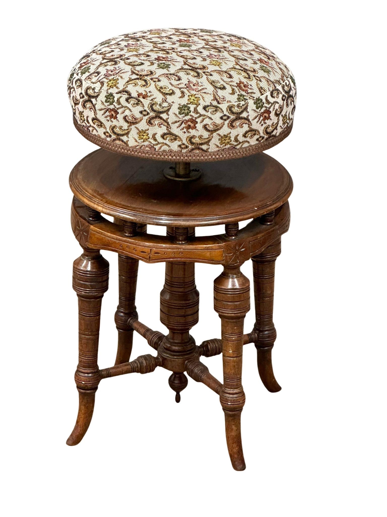 A late Victorian walnut revolving piano stool. Circa 1880-1890 - Image 4 of 5