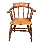 A Mid Victorian elm and beech elbow chair.