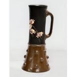 An Early 20th Century Bretby Pottery jug. 24.5cm
