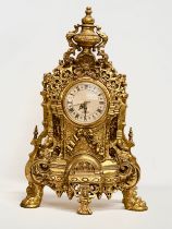 A large 18th Century style French gilt mantle clock. 35x20x59cm