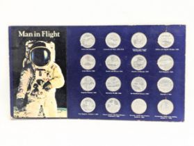 A collection of 16 coins commemorating 'Man In Flight,' by Shell. A record of the great events in