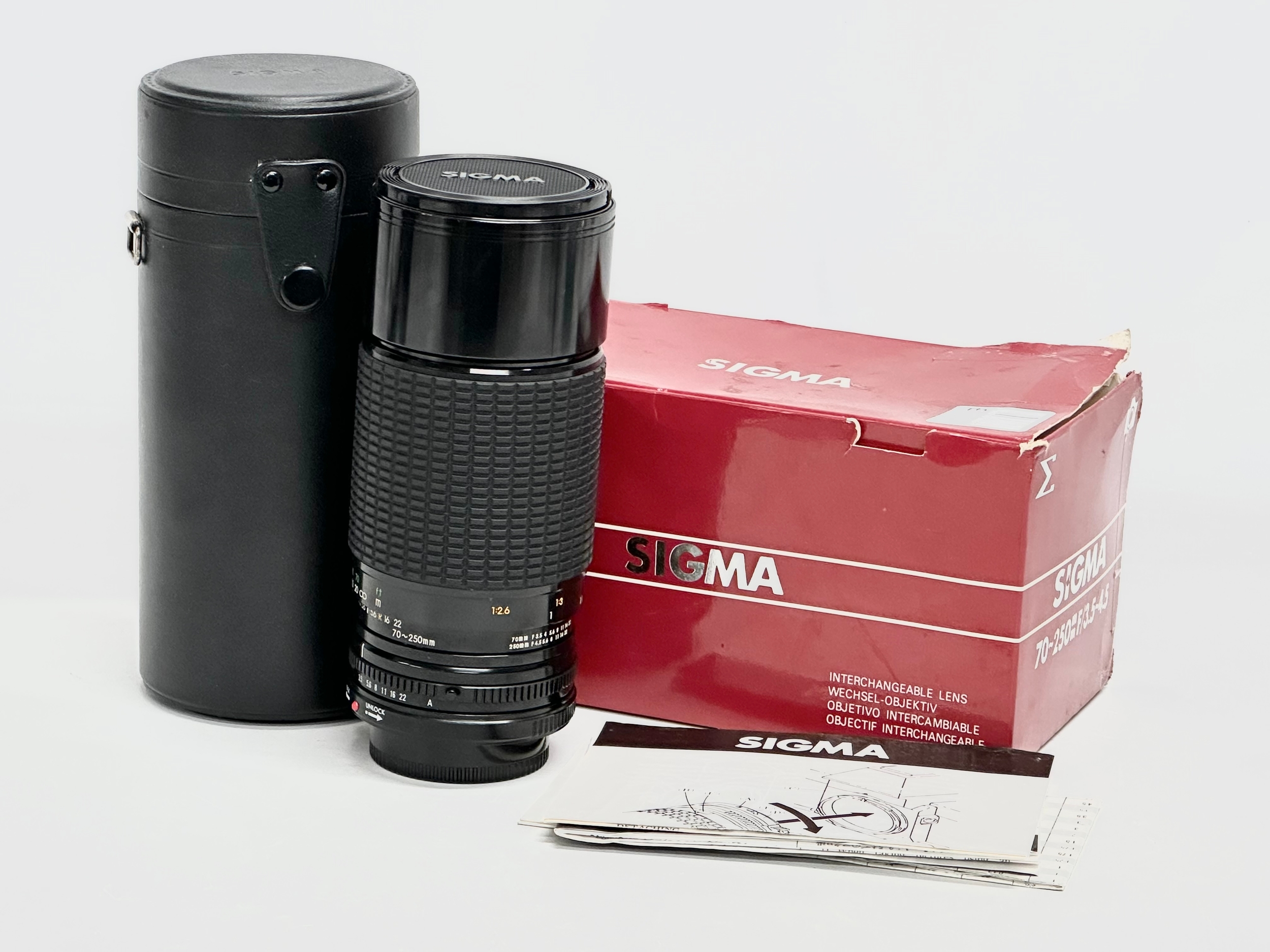 A Sigma Zoom II Multi-coated camera lens with box and case. 5924621