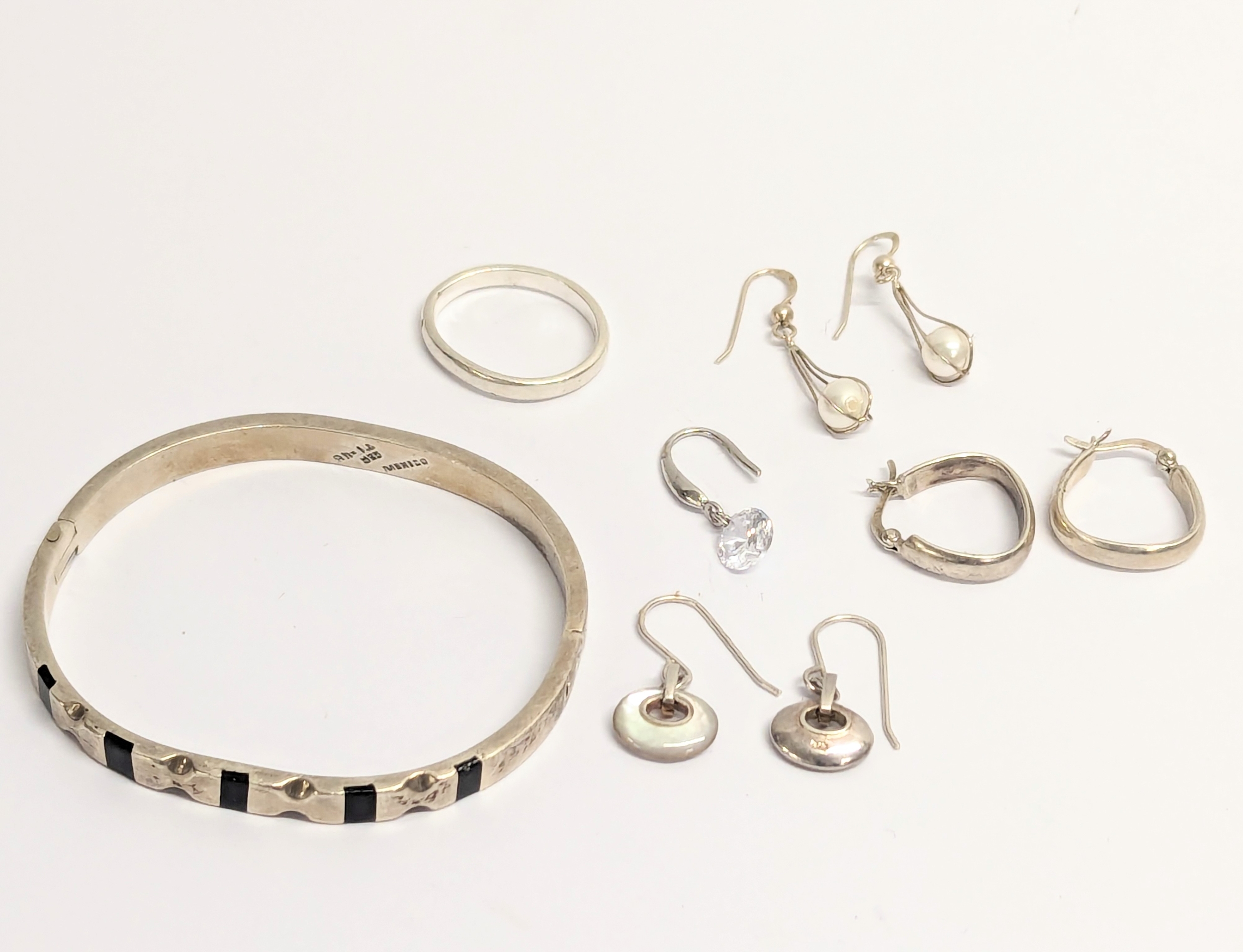 A quantity of silver including bangle, earrings, ring. Total weight 42.9g