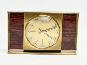 A Mid 20th Century brass and rosewood mantle clock by Smiths. 23.5x14.5cm