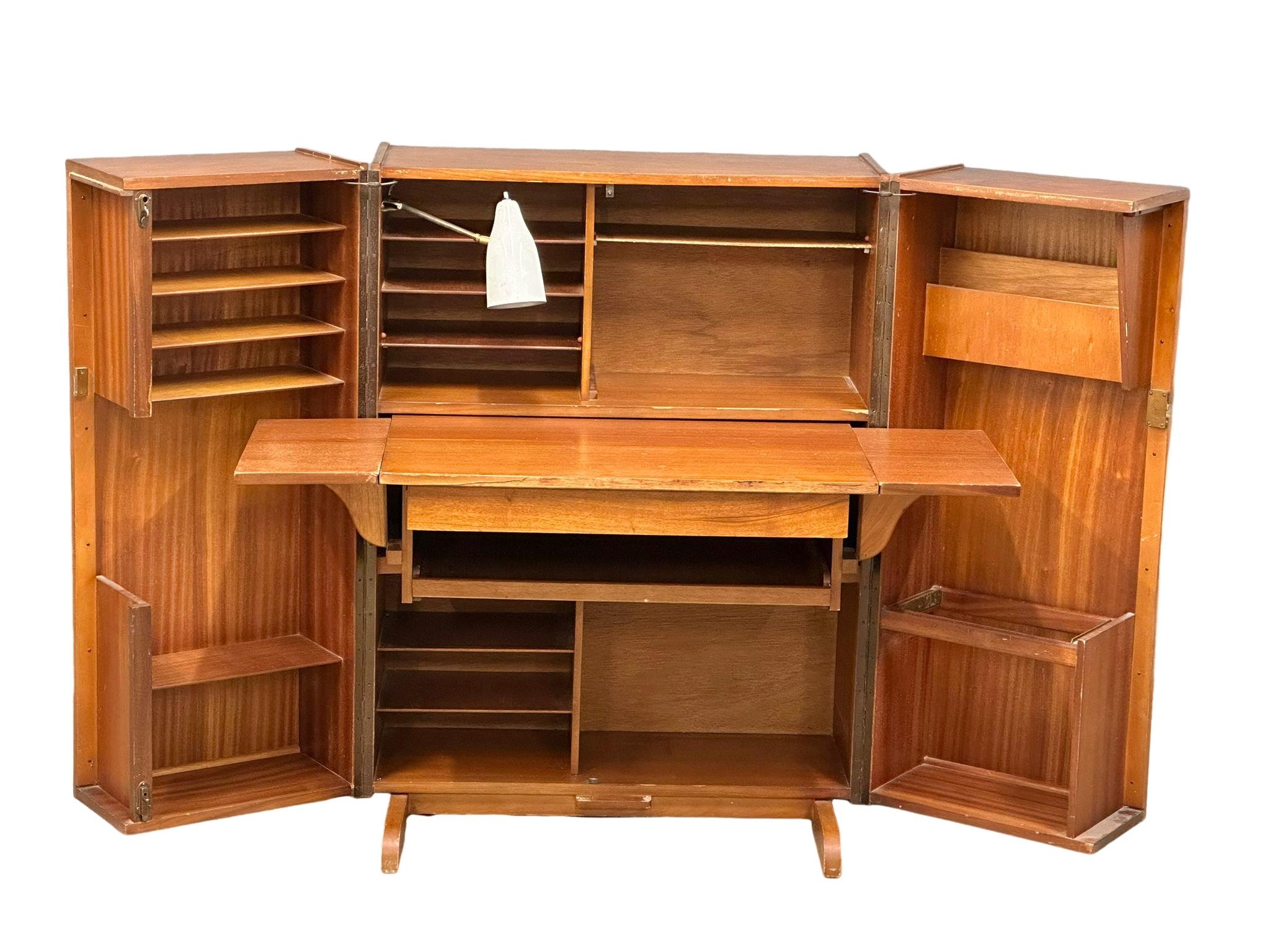 A Mummenthaler and Meier Mid Century teak ‘Magic Box’ folding desk. Open 168x73x114cm. Closed