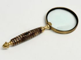 A brass magnifying glass. 25.5cm