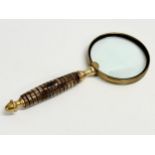 A brass magnifying glass. 25.5cm