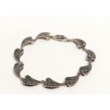 A silver and marcasite bracelet.