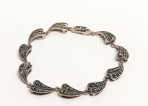 A silver and marcasite bracelet.