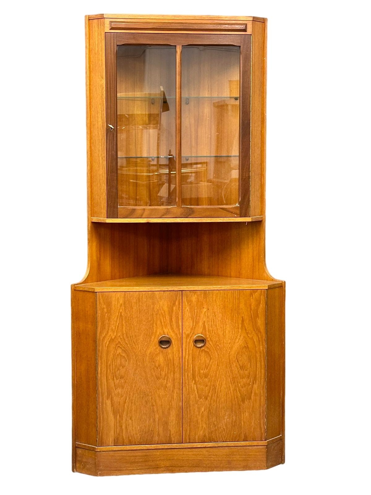 A Mid Century teak corner cabinet by Turnidge of London. 86x42x179.5cm(9)