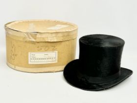 An early 20th century J. Wippell and Co LTD top hat with a Ellwood Hats LTD box. Circa 1910.