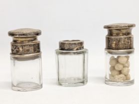 2 early 20th century Walker & Hall silver topped vanity bottles, Birmingham, 1914-1915. With other