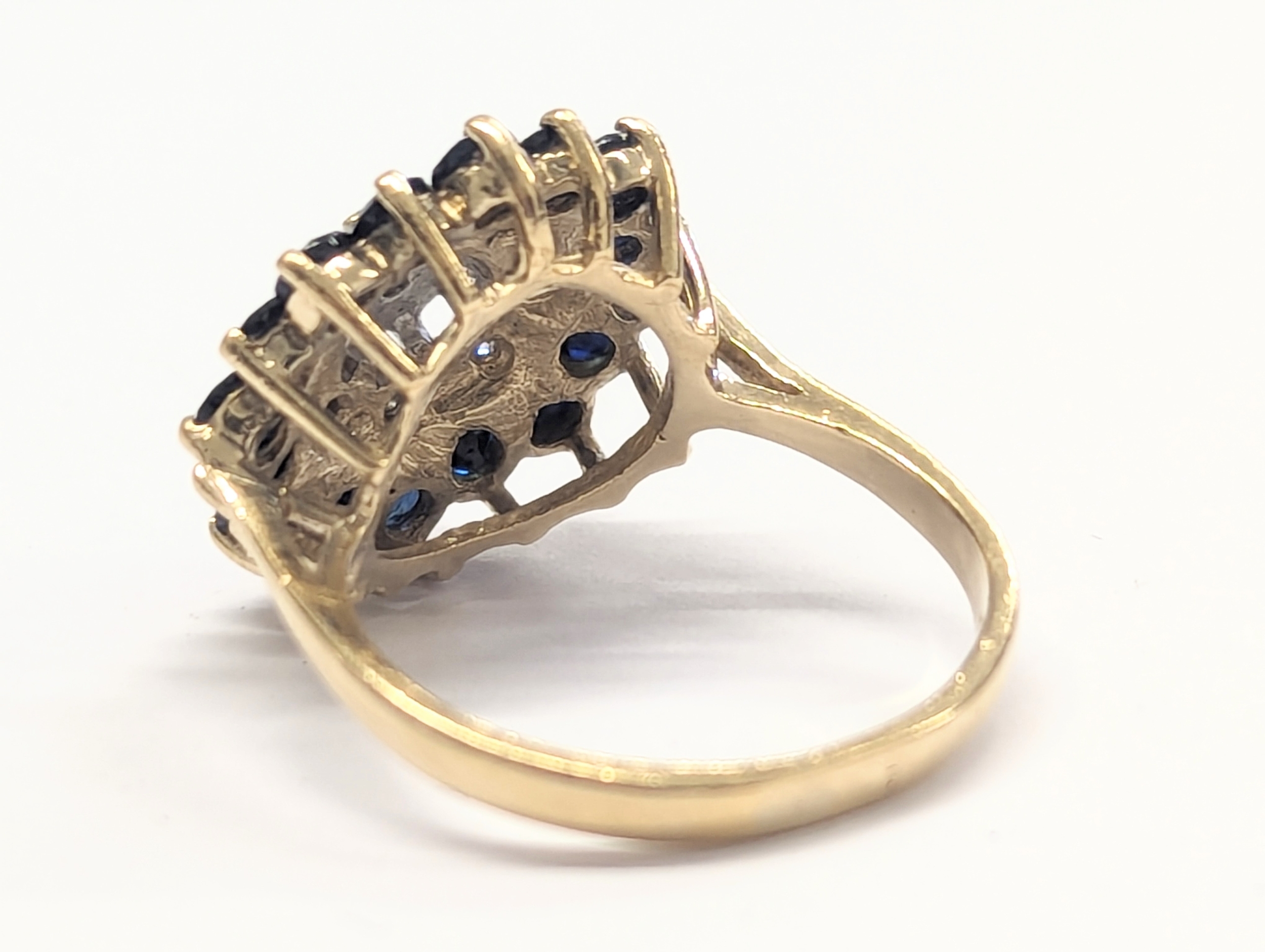 A 9ct gold, diamond and sapphire ring. 3.88g. Size UK K 1/2. - Image 3 of 4