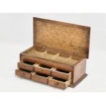 An Early 20th Century oak watchmakers chest. 23x12x9cm