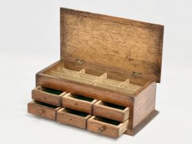 An Early 20th Century oak watchmakers chest. 23x12x9cm