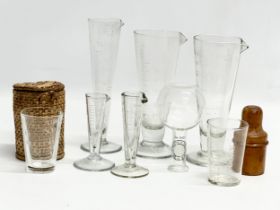 A collection of Early 20th Century glass measures. 17cm, 16cm, 10cm