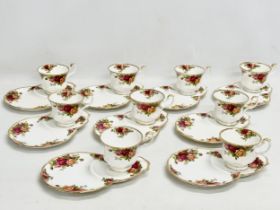 A quantity of Royal Albert ‘Old Country Roses’ tea cups and snake plates.