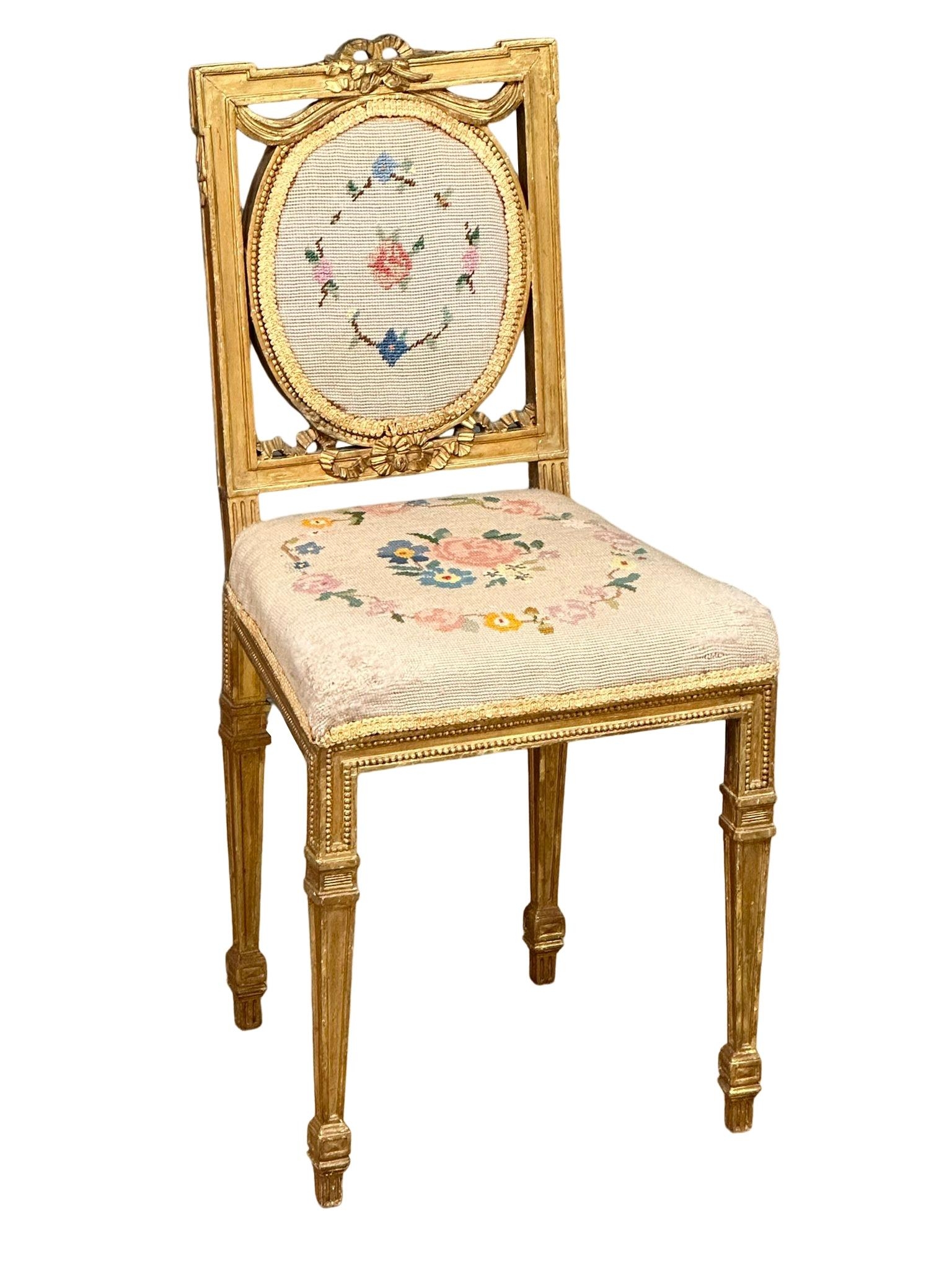 A late 19th century French Louis XVI style gilt side chair/hall chair. Circa 1880-1900.