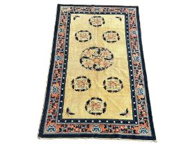 A vintage Middle Eastern hand knotted rug. 133x228cm