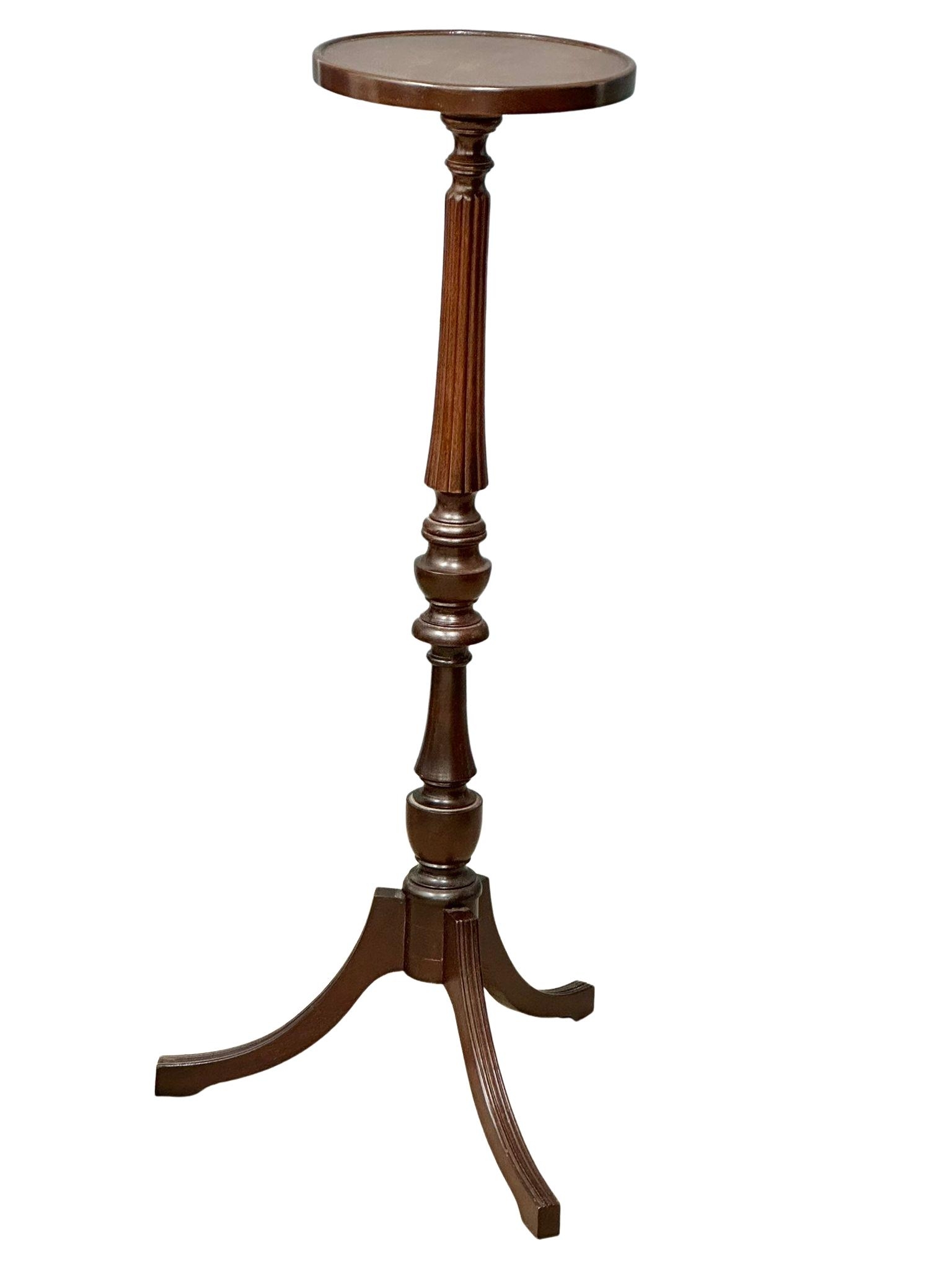 A mahogany torchiere/plantstand. 100cm