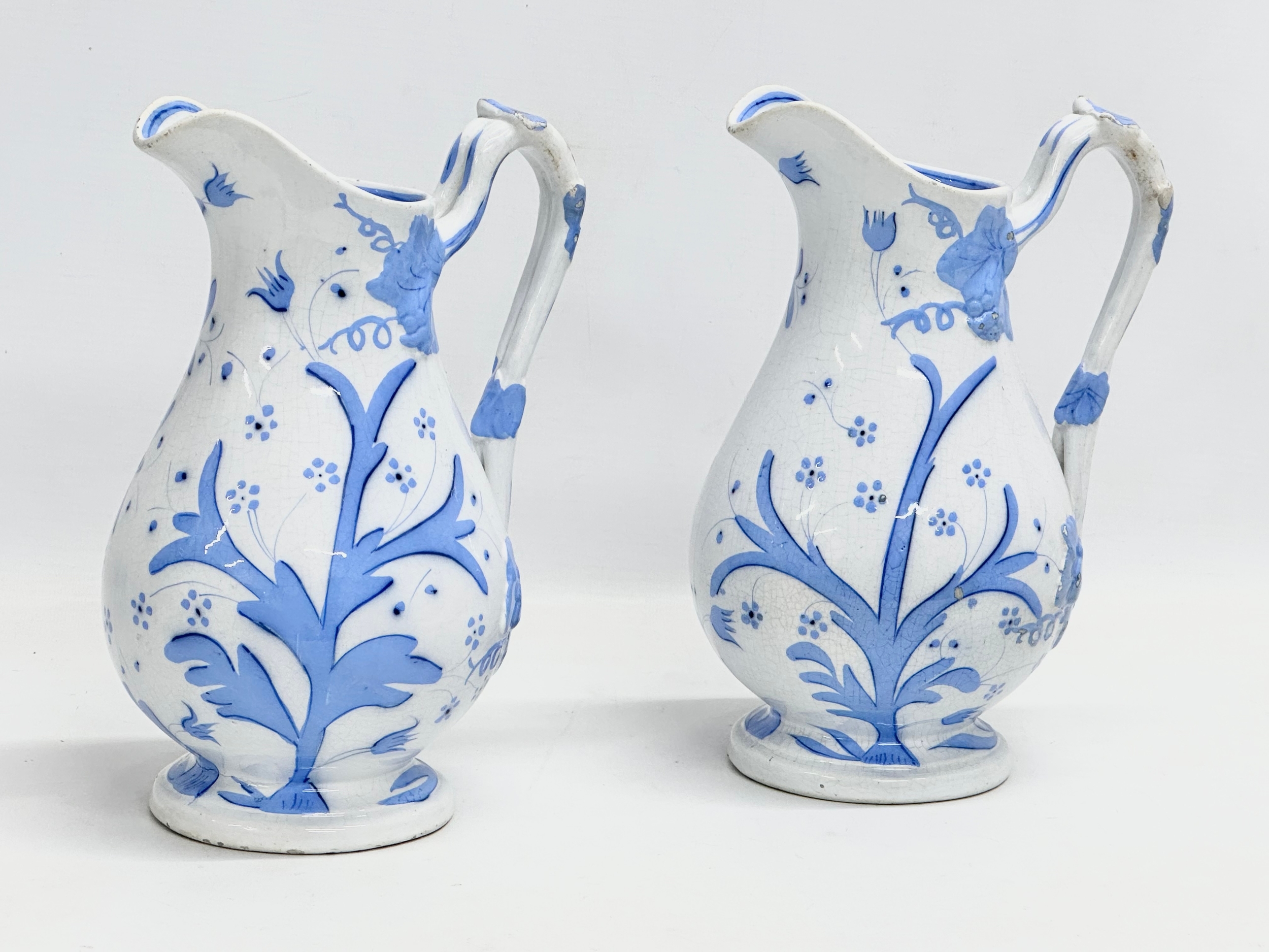 A pair of Late 19th Century Scottish baluster water jugs. 14x23cm