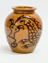 A glazed slip ware dragon vase by Hans Ullrich. 8x10cm