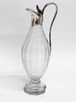 A late George III glass and silver plated vinegar bottle. 20cm