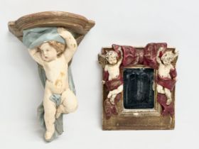 A cherub wall bracket and mirror. 23x31cm. 23x23cm