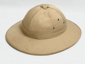 A British Military Pith Helmet. 30x35x13.5cm