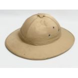 A British Military Pith Helmet. 30x35x13.5cm