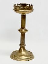 A late 19th century brass church candlestick. 31cm