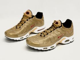 A pair of Nike TN Air Max Metallic Gold trainers. UK size 9.5.