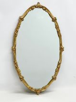 A vintage gilt framed mirror. 41x72cm