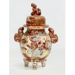 A Late 19th Century Japanese hand painted pottery urn with lid by Satsuma. Circa 1890. 15x23cm