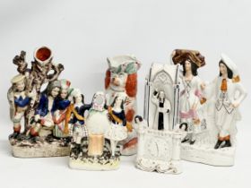 A collection of 19th Century Staffordshire figures. The Rival spill vase 30cm. Highland Harvest