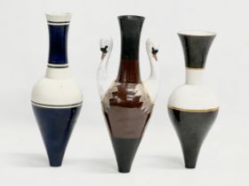 A set of 20th Century painted ceramic vases with narrow necks and bases. Stamped underneath. 25cm