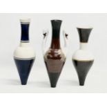 A set of 20th Century painted ceramic vases with narrow necks and bases. Stamped underneath. 25cm