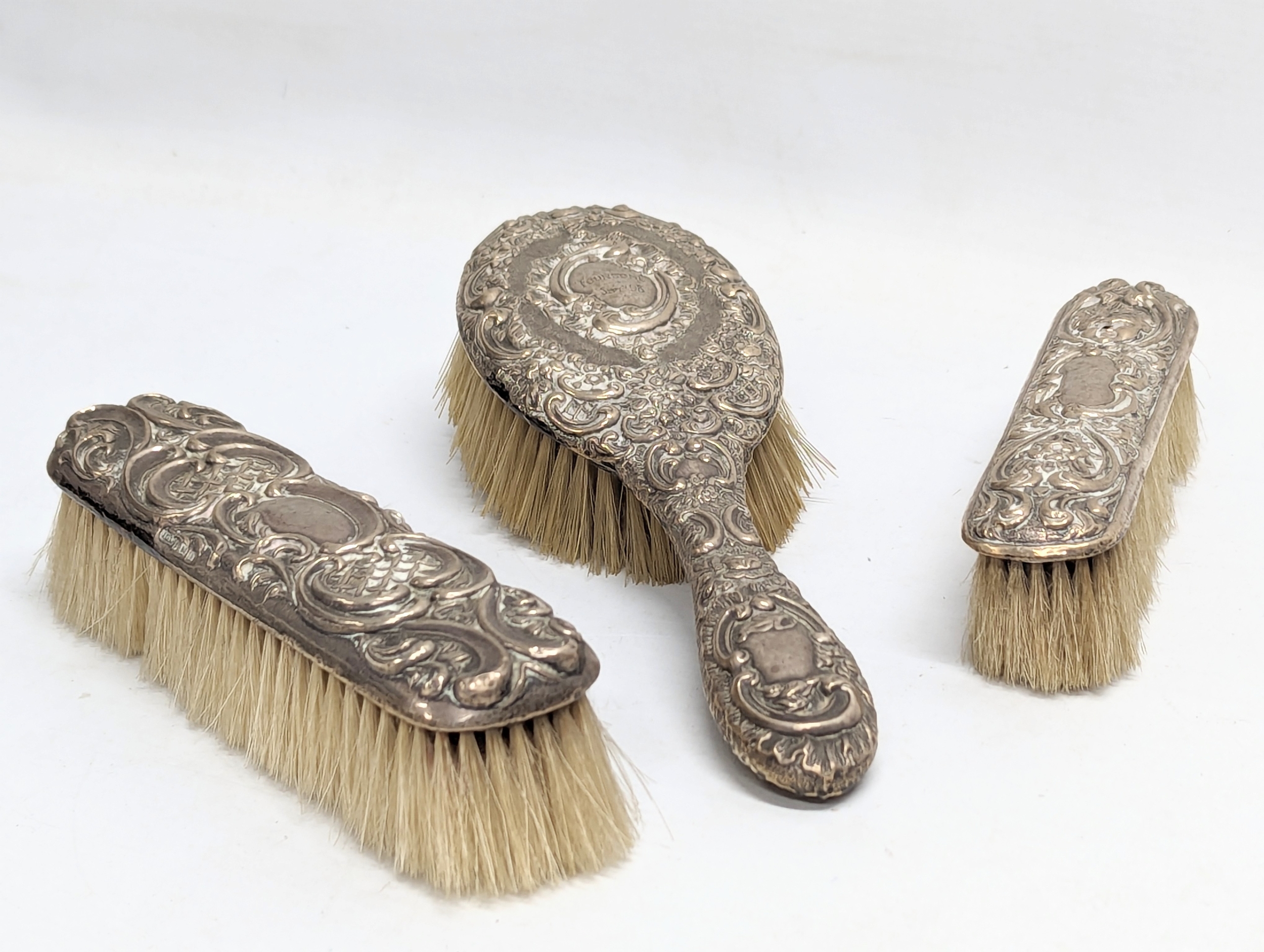 3 late 19th / early 20th century silver vanity brushes. William Aitken, Chester, 1900. George Nathan